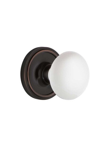 Classic Rosette Mortise Lock Set With White Porcelain Door Knobs in Timeless Bronze.